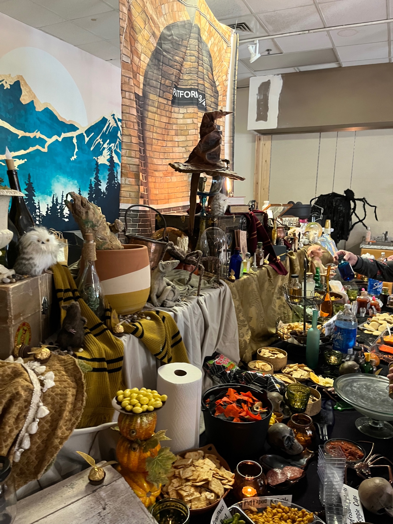 A themed wizard party spread with treats and decorations at the studio