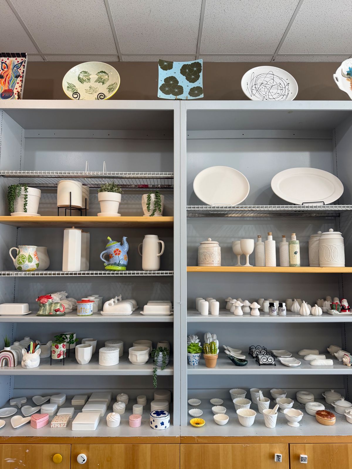 Shelves of ready-to-paint pottery bisque at Paint Fusion Park City