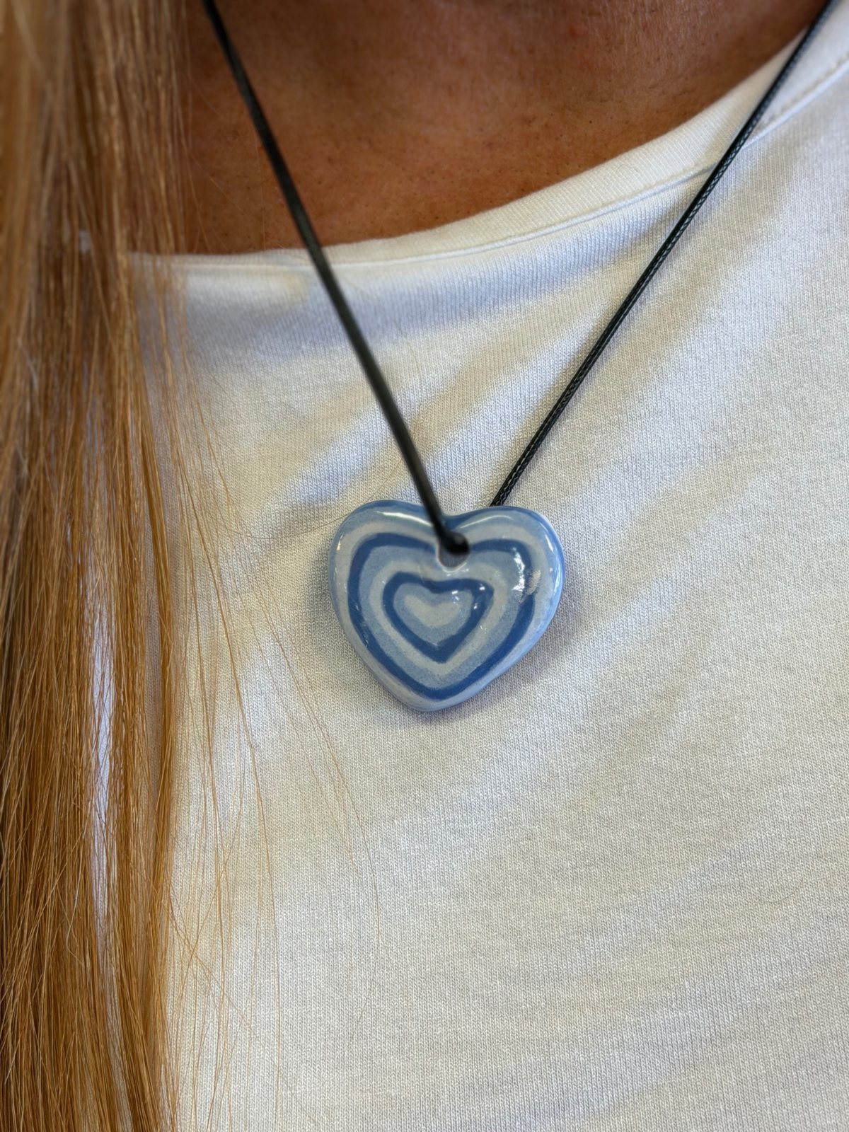 Finished hand-painted blue and white ceramic heart pendant